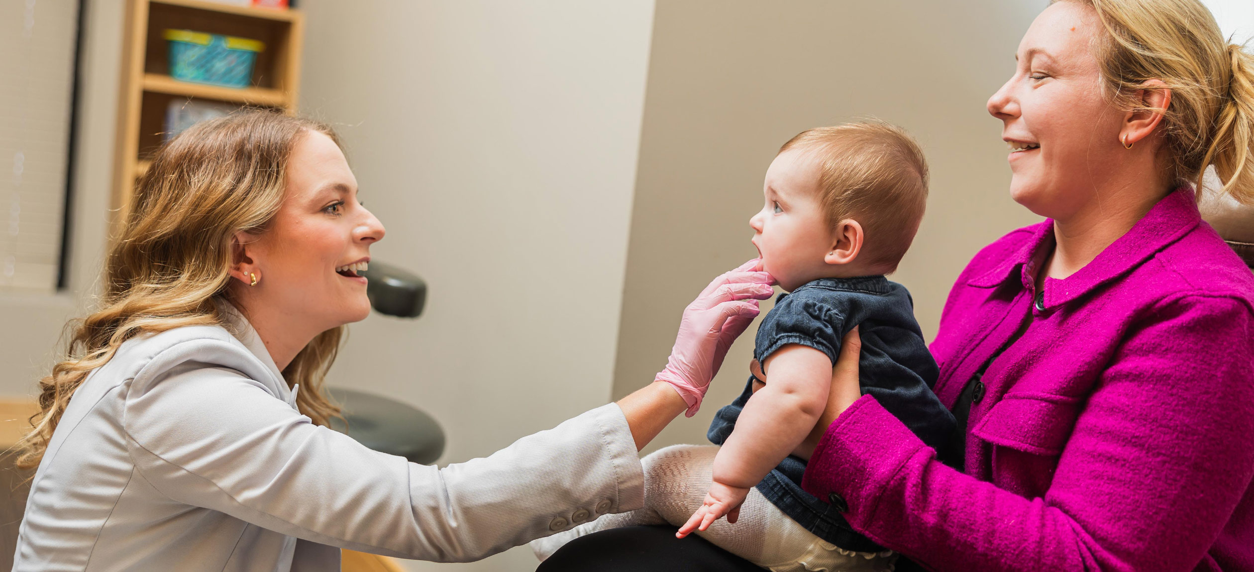 Examining baby's mouth