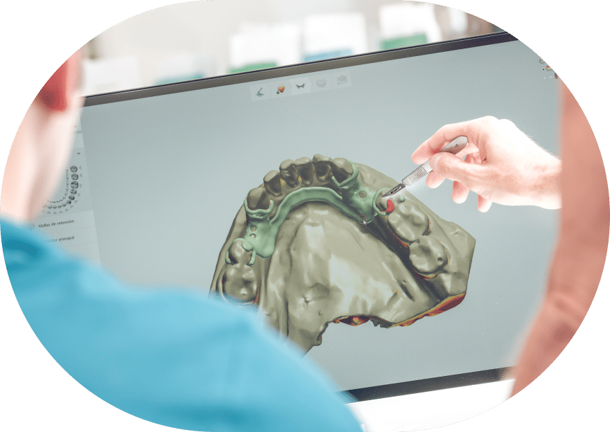 A man demonstrates a dental model on a computer screen, highlighting dental education and technology in practice.